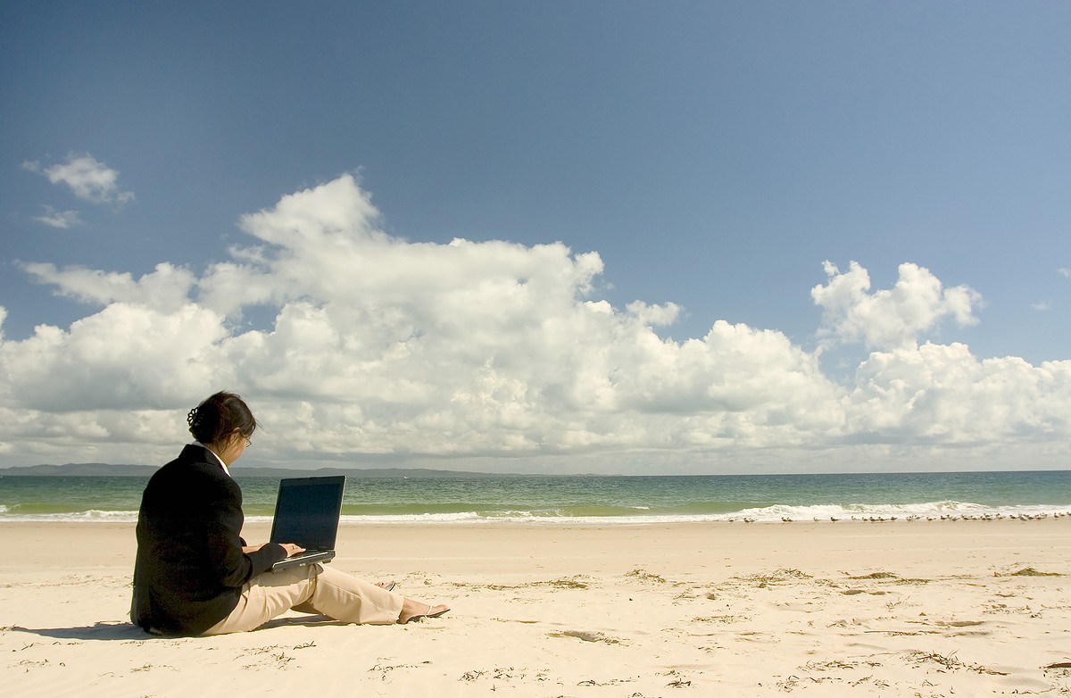 Man at beach with clouds